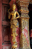 Chiang Mai - The Wat Phra Singh temple. Detail of the entrance door of the ubosot (ordination hall). 